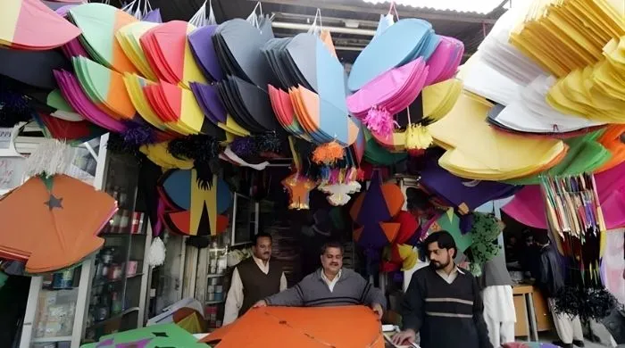 A kite shop in Lahore with various kites in it.
