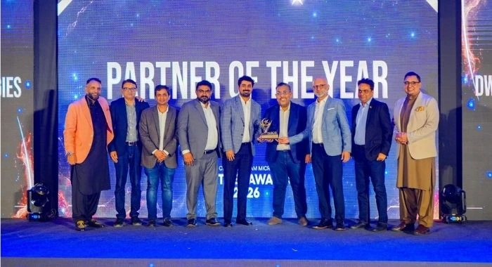 DWP Technologies team receives the Partner of the Year award at the Cisco Partner Awards FY 2025–26 in Karachi.